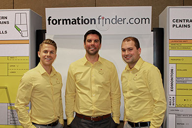 Three Formation Finder.com staff wearing uniform shirts at a trade show